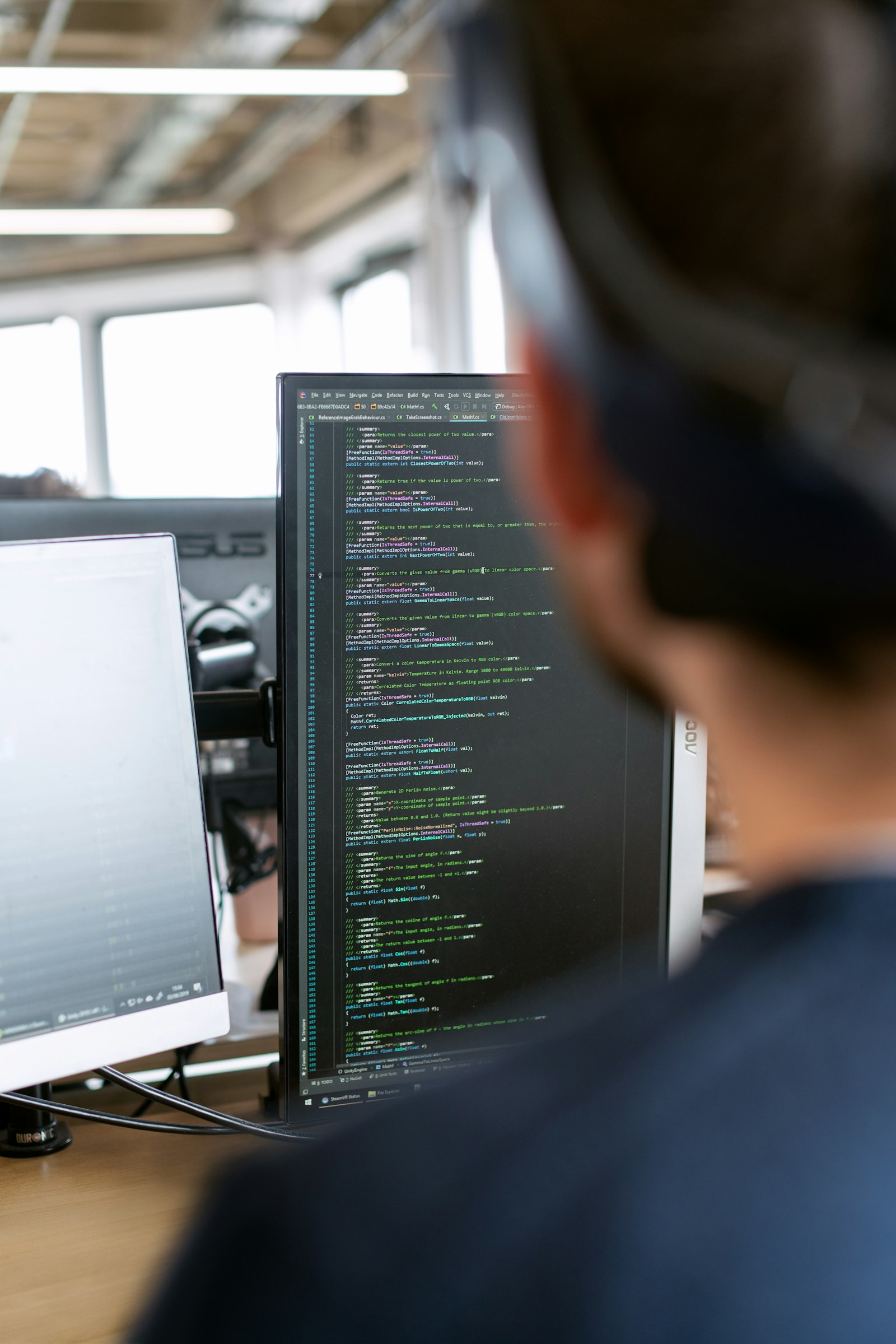HVAC answering service — AI vs traditional call centers HVAC technician working on a rooftop condenser unit while service calls are answered automatically