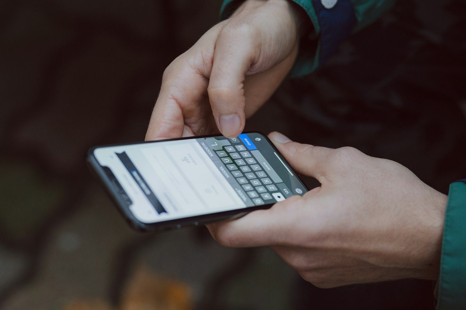 What is missed call text back and how it works Hands typing a text message reply on a smartphone after missing a business call