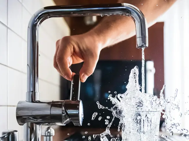 Plumbing AI Phone 360 receptionist Plumber testing a repaired kitchen faucet with running water — the AI Phone 360 plumber answering service handles the calls meanwhile.